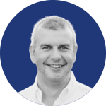 customer headshot -p simon blockley - impellam - blue background - round